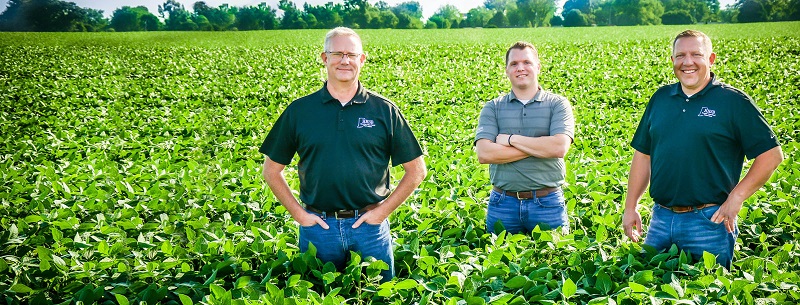 Agriculture team of Jeff Kiger, Jordan Burkett and Josh Foxworthy standing in a bean field